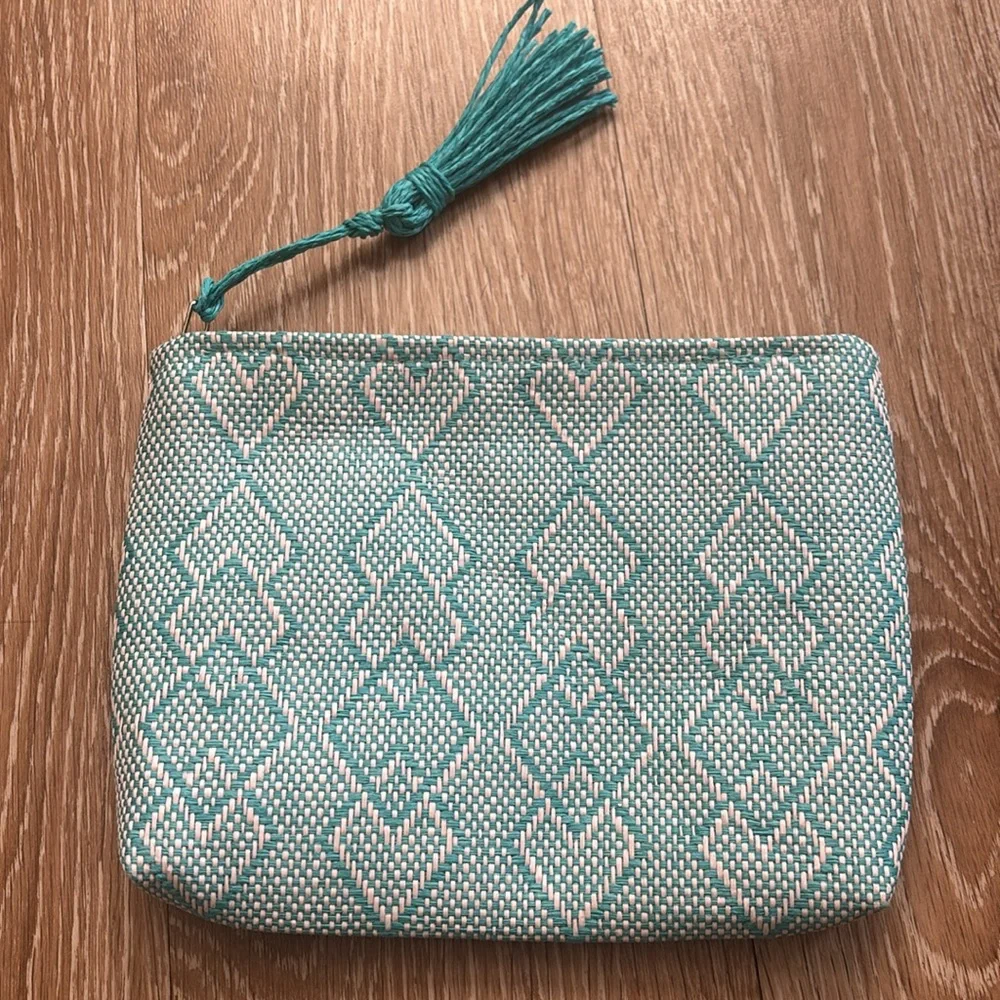 Josie Maran white/turquoise patterned woven cosmetic/makeup bag